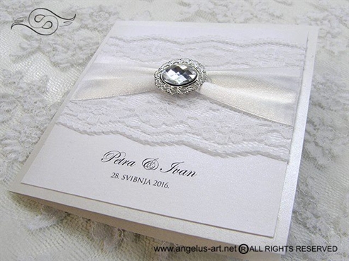 wedding invitation with lace and brooch
