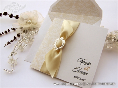 cream luxury wedding invitation with bow